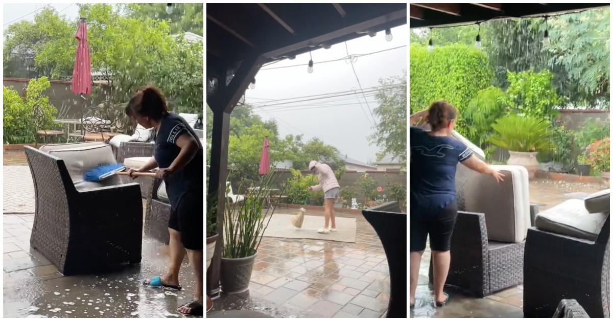 TikToker's mom vigorously cleans couch cushions and rug with a brroom during Hurricane Hilary. 