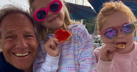 Mike Rowe poses with two of his youngest fans.