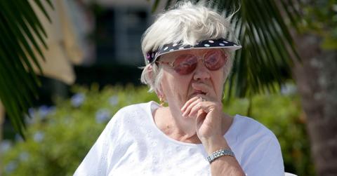 Woman sitting in chair at outdoor event