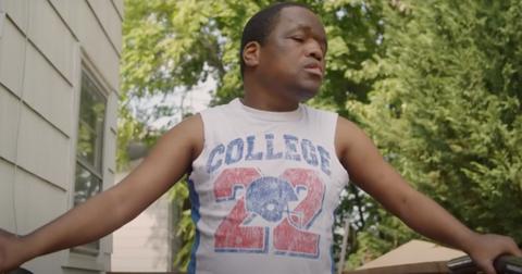 Derrick Johnson poses in a tank top in his backyard