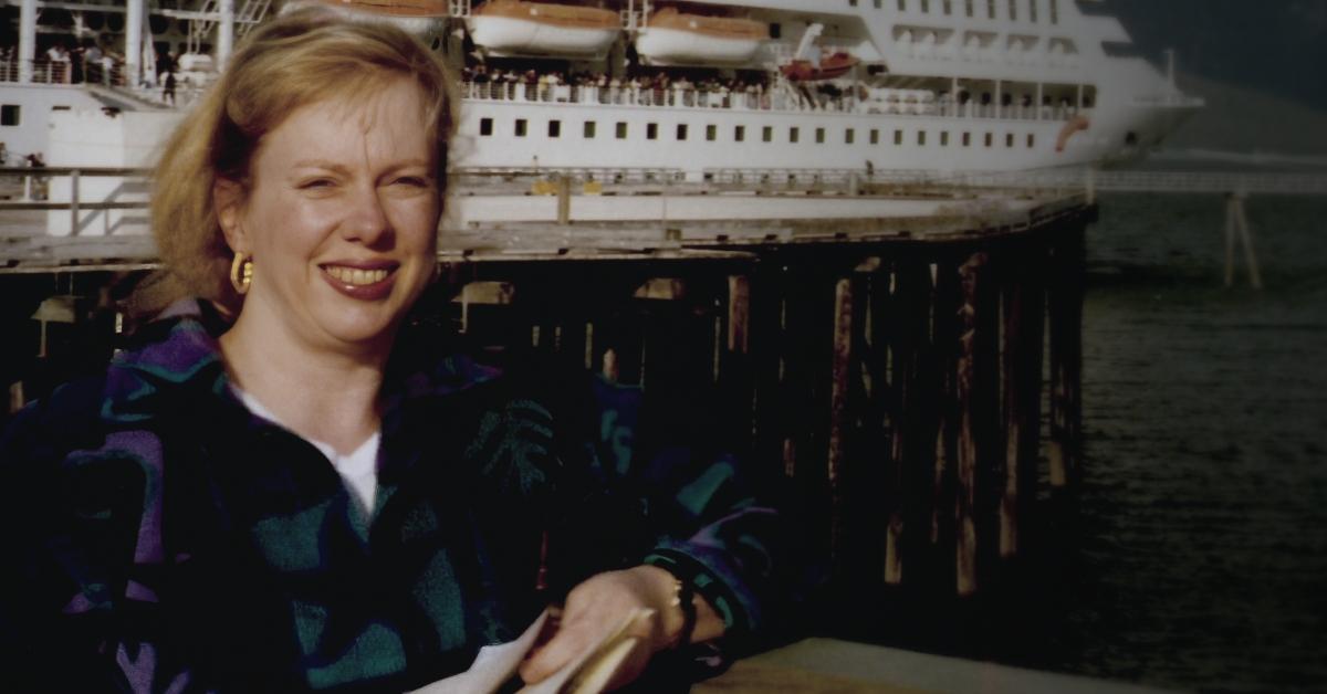 Jana Carpenter-Koklich stands in front of a cruise ship