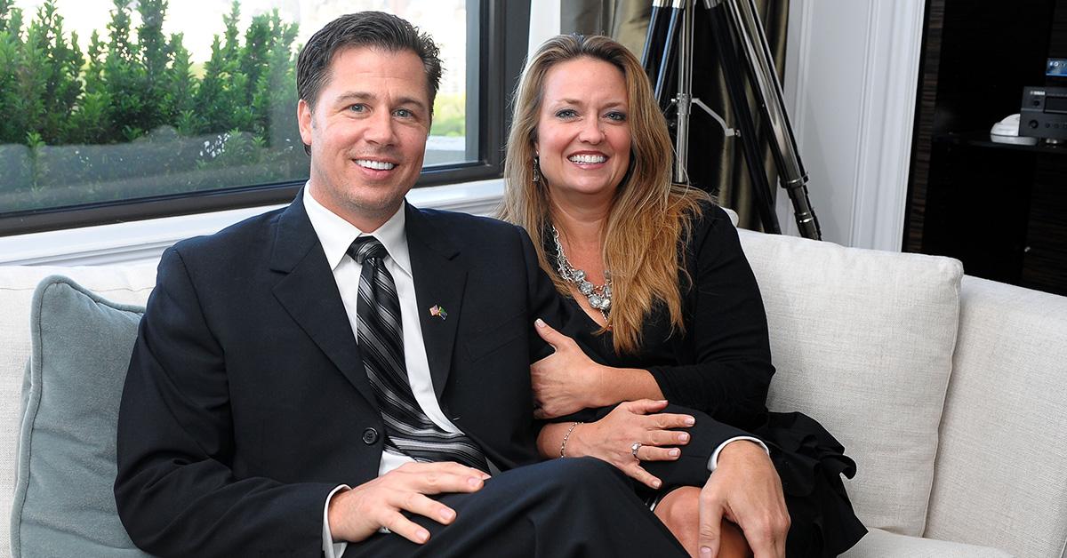 Doug and Lisa Pitt sitting on a couch together. 