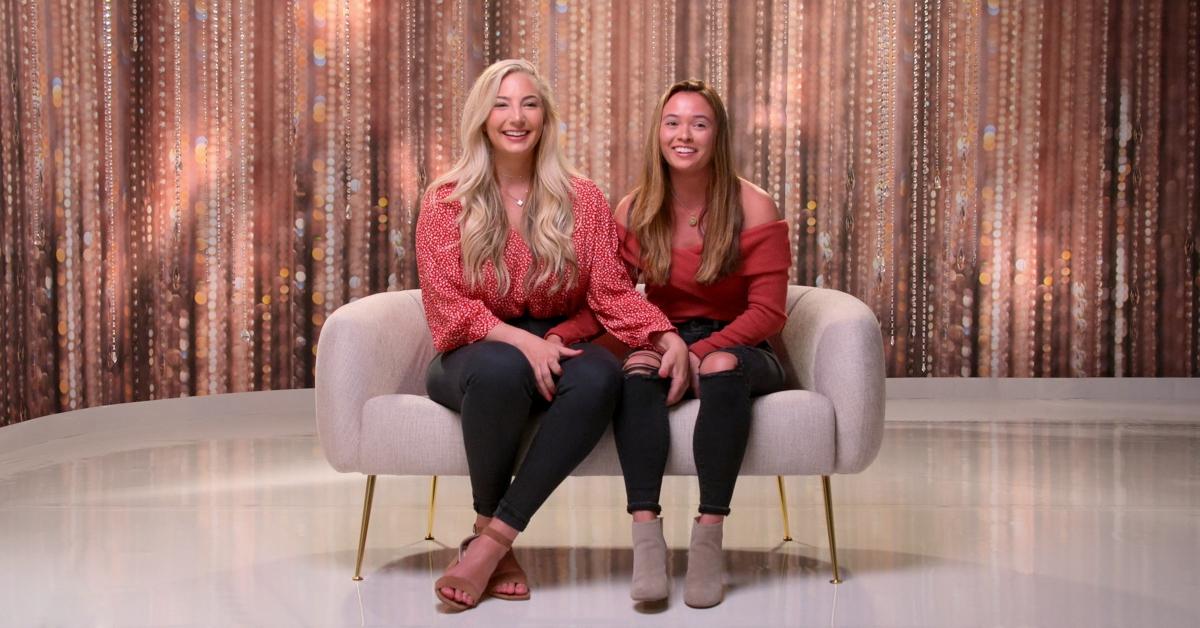 Lexi and Rae sit on a couch and talk to producers on 'The Ultimatum: Queer Love'