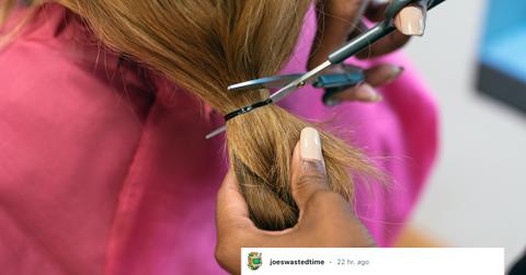 A woman getting her hair cut