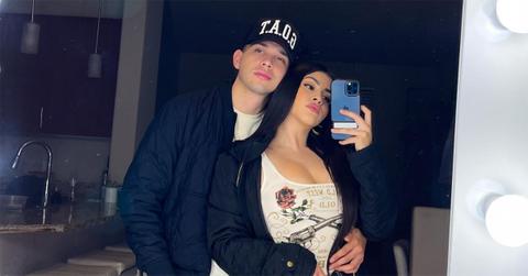 Carlos Parra and Lillian Griego take a mirror selfie.