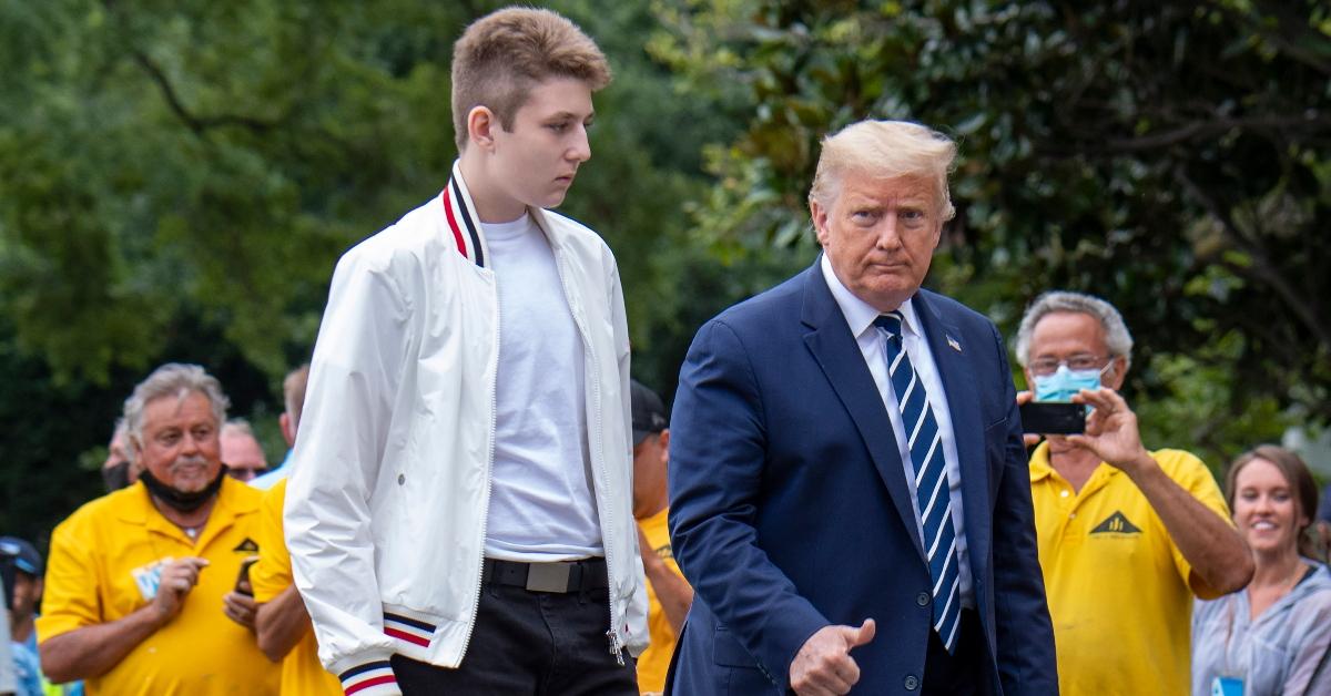 US President Donald Trump returns to the White House with his son Baron (L) after a weekend in Bedminster on August 16, 2020 in Washington. (Photo by Eric BARADAT / AFP) (Photo by ERIC BARADAT/AFP via Getty Images)