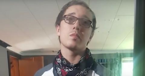 Brandon Clark takes a selfie using a mirror