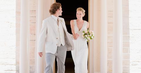 Bride and groom holding hands