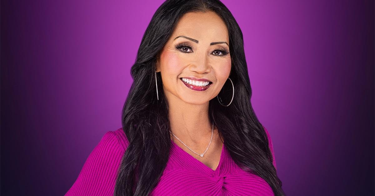 Kelly from MILF Manor in front of a purple background
