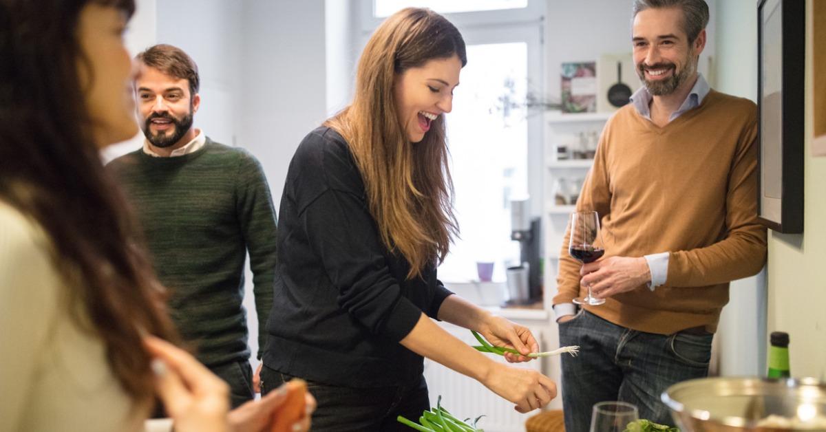 friends preparing food in kitchen picture id