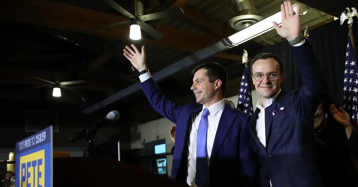 Pete and Chasten Buttigieg attend a political event.