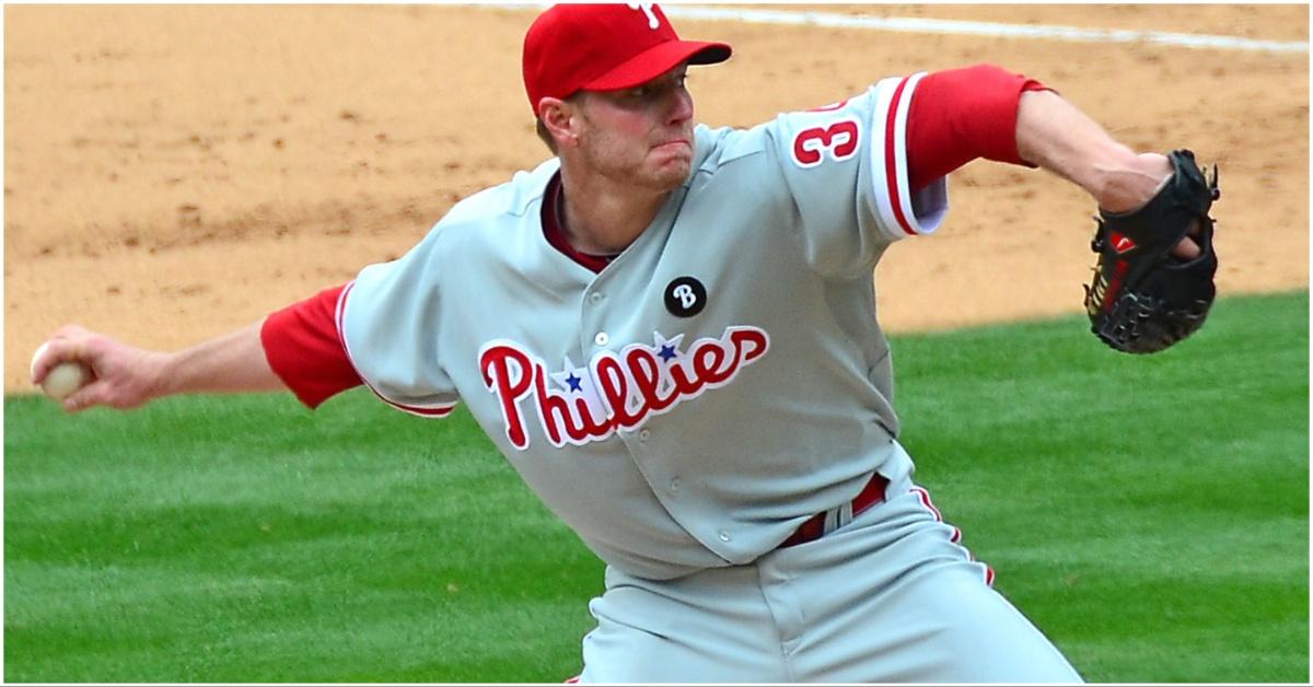 Roy Halladay winding up to throw a pitch