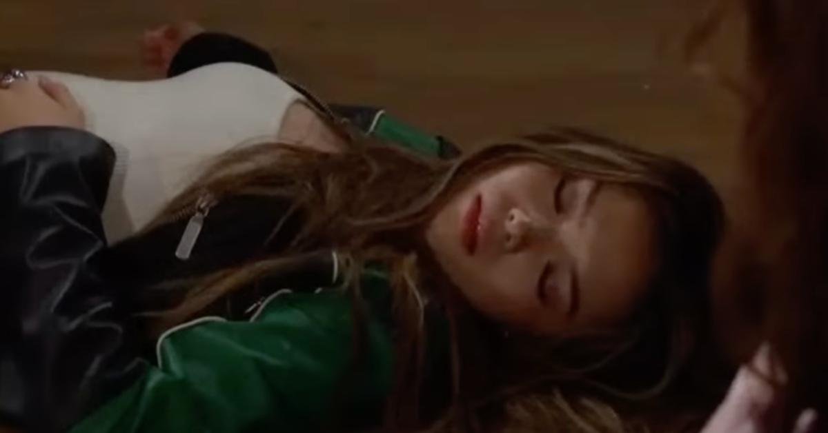 Luna lying on the floor after getting shot by Liam.