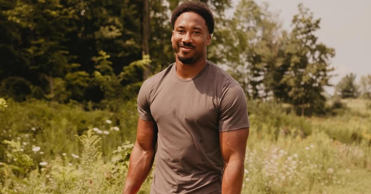 Myles Garrett walking on a trail with his dog.