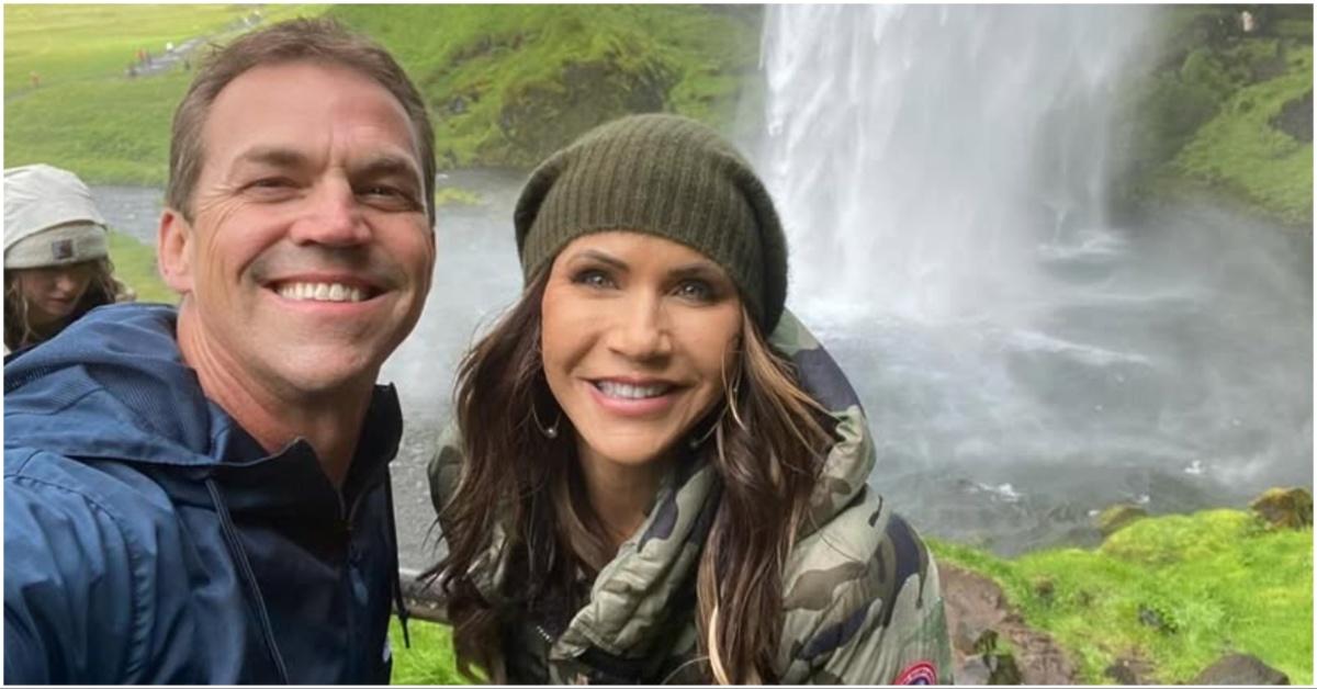 Kristi and Bryon Noem in front of a waterfall