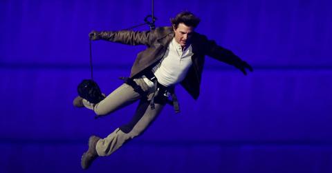 PARIS, FRANCE - AUGUST 11: Actor Tom Cruise jumps from the roof of the Stade de France during the Closing Ceremony of the Olympic Games Paris 2024 at Stade de France on August 11, 2024 in Paris, France. (Photo by Fabrizio Bensch- Pool/Getty Images)