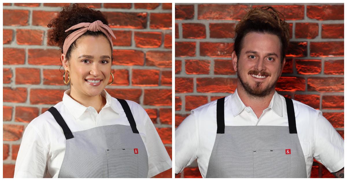 Christina Miros and Zach Laidlaw from Season 3 of 'Next Level Chef' stand in front of a brick wall wearing gray aprons.