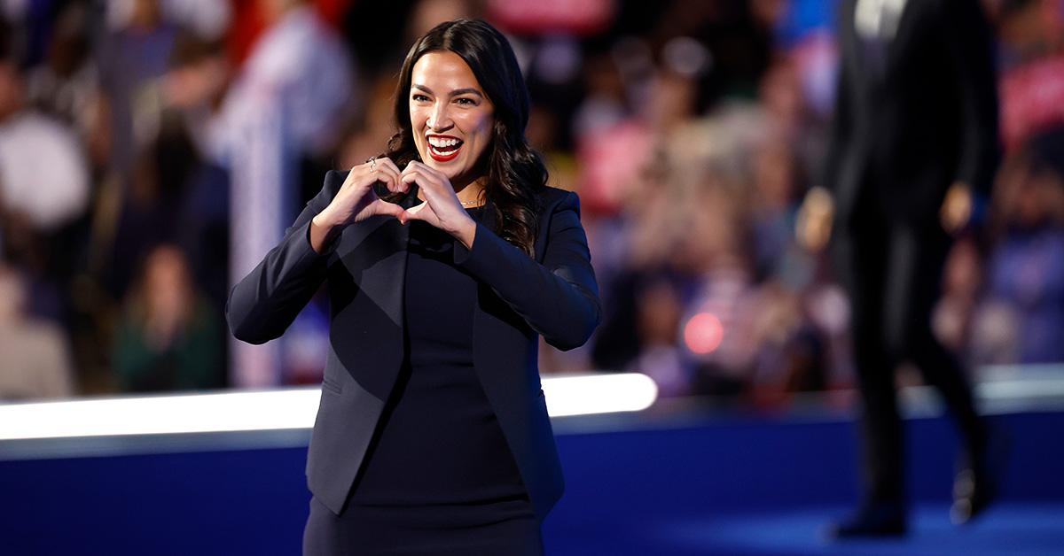 AOC making a heart with her hand at the Democratic National Convention