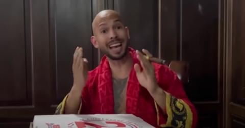 andrew tate with pizza box