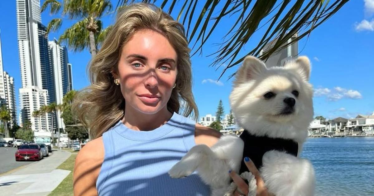 Bonnie Blue with her dog on a beach.