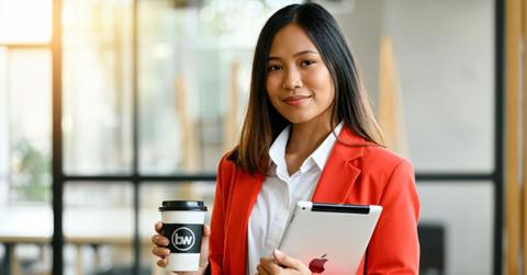 woman holding coffee cup