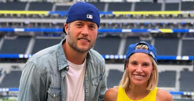Matthew Stafford and his wife Kelly Stafford at a stadium.