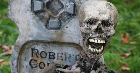 A scary skeleton and tombstone