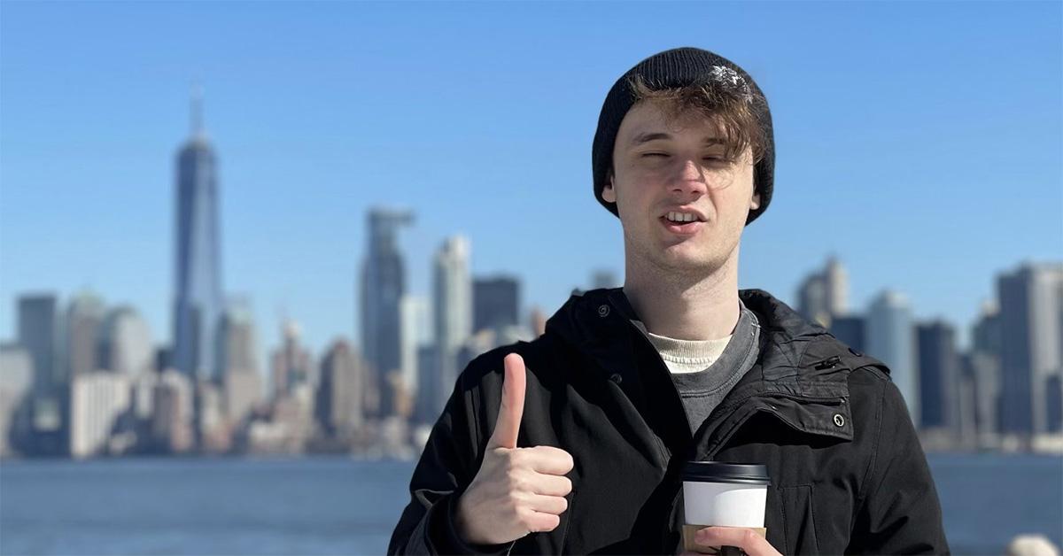 Wilbur Soot giving a thumbs up with the Manhattan skyline behind him. 
