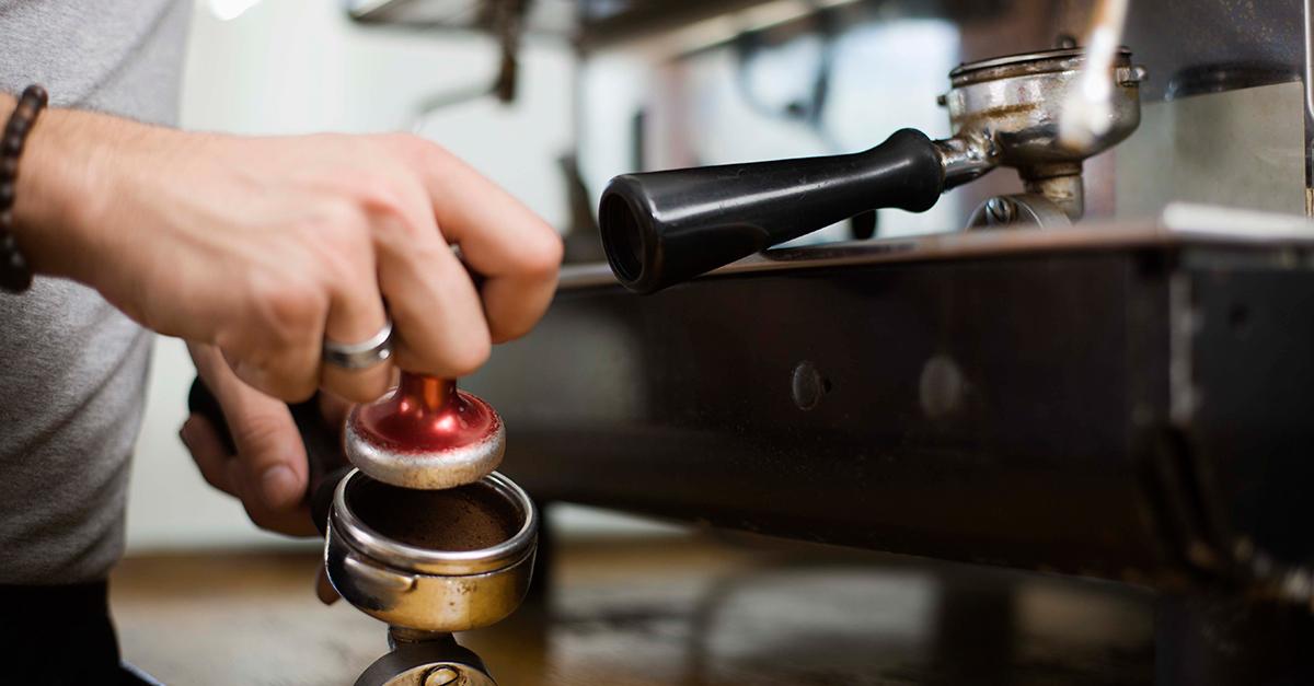 A barista making coffee