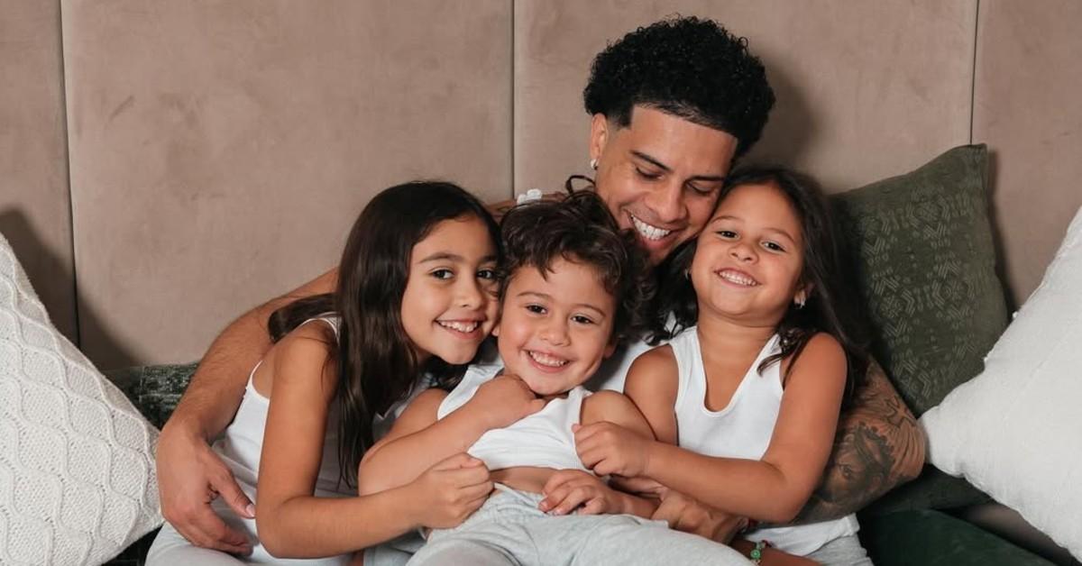Austin McBroom and his children hugging