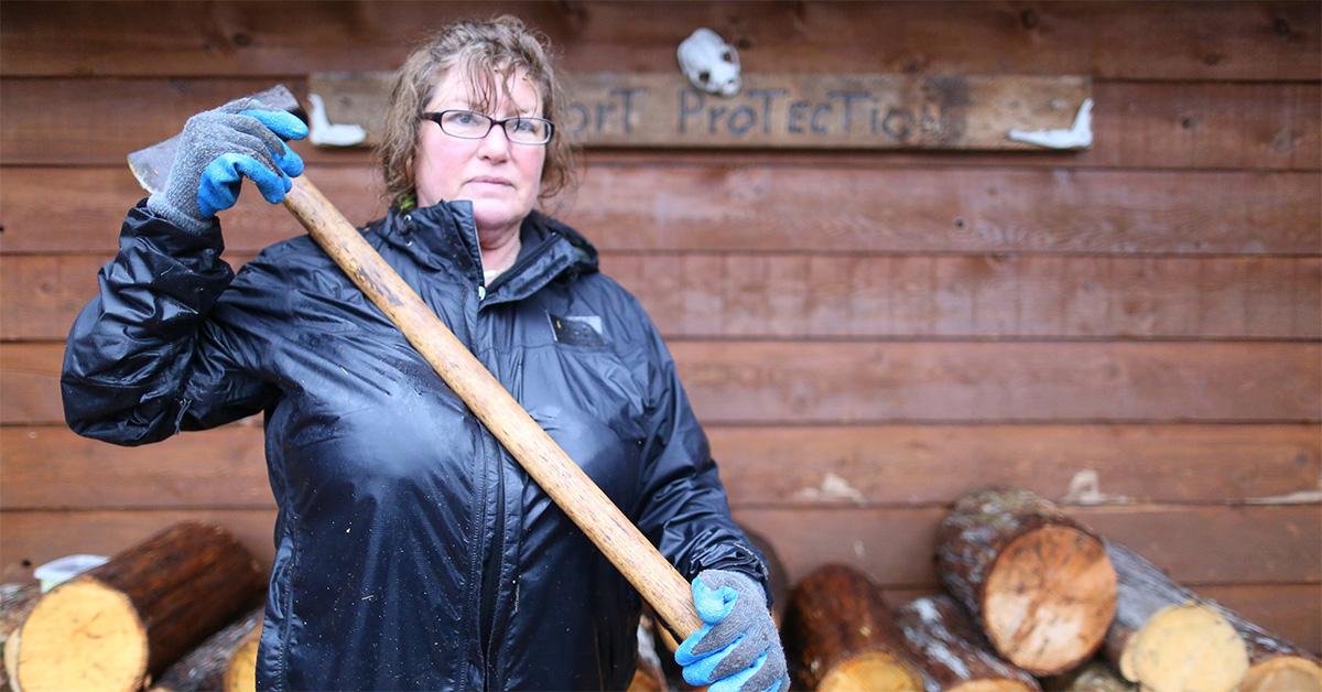 Mary Miller holding an axe in 'Port Protection.' 