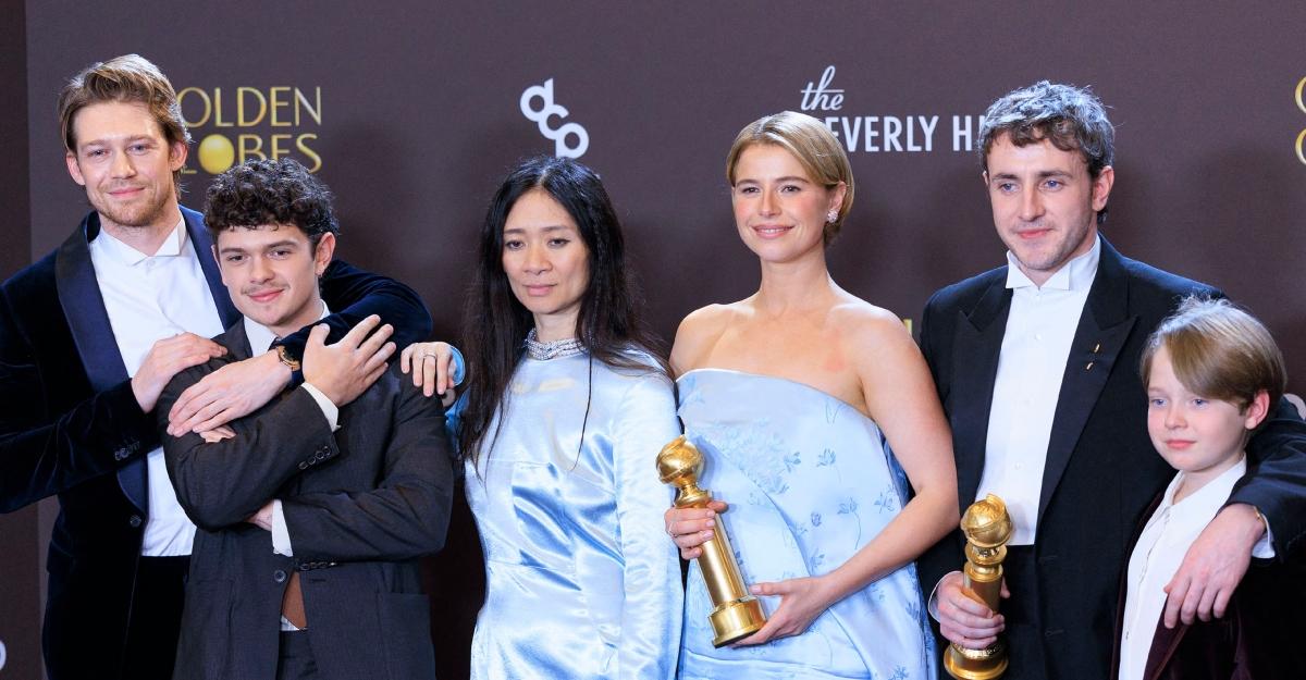 Chloé Zhao poses with actors from Hamnet after winning Golden Globes.