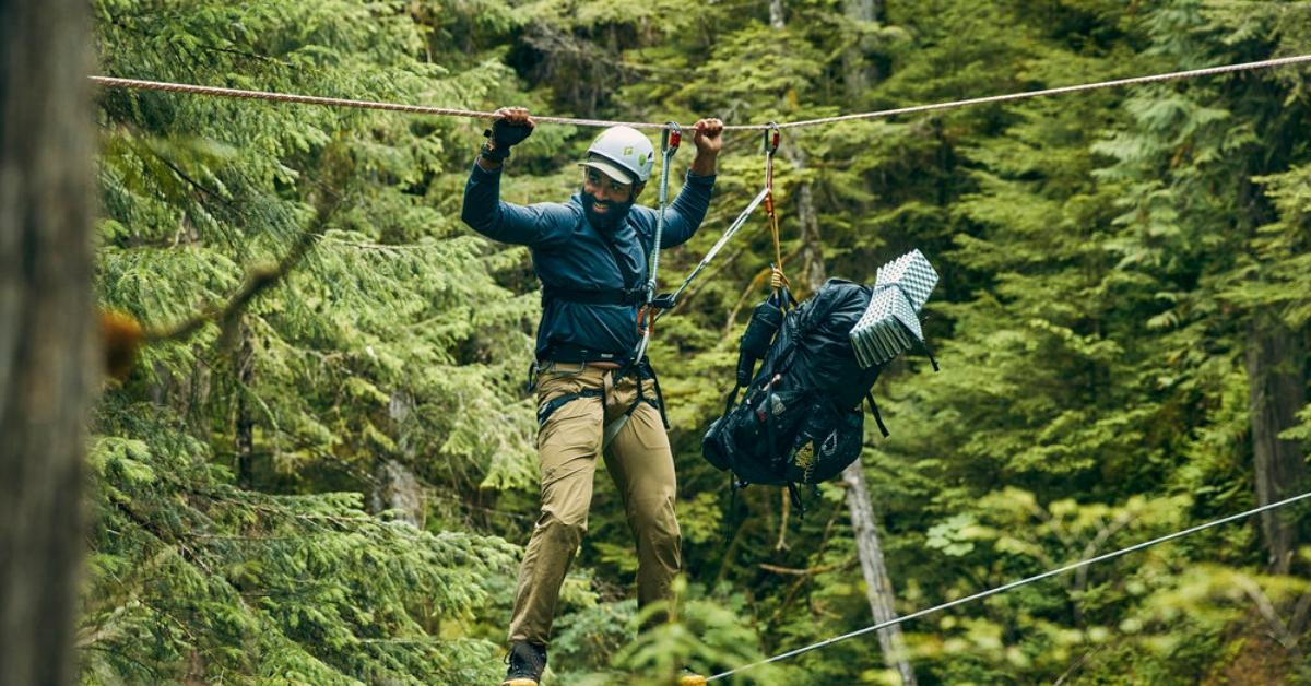 'Race to Survive Alaska': Max Djenohan crossing a rope bridge in Season 1.