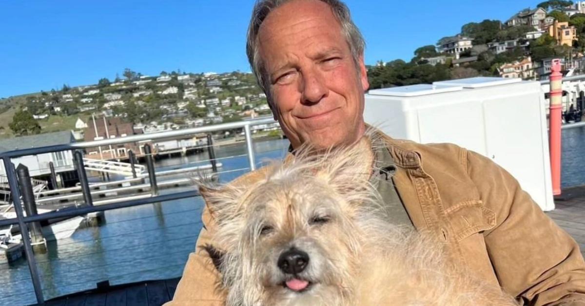 Mike Rowe now sitting by the water with his dog Freddy.