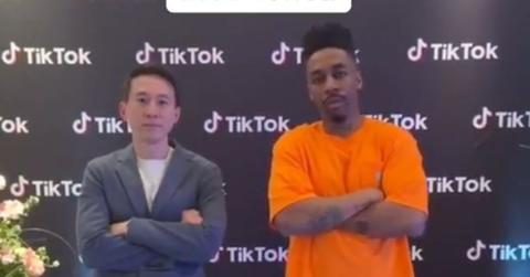 Dax and Shou Zi Chew standing next to each other.