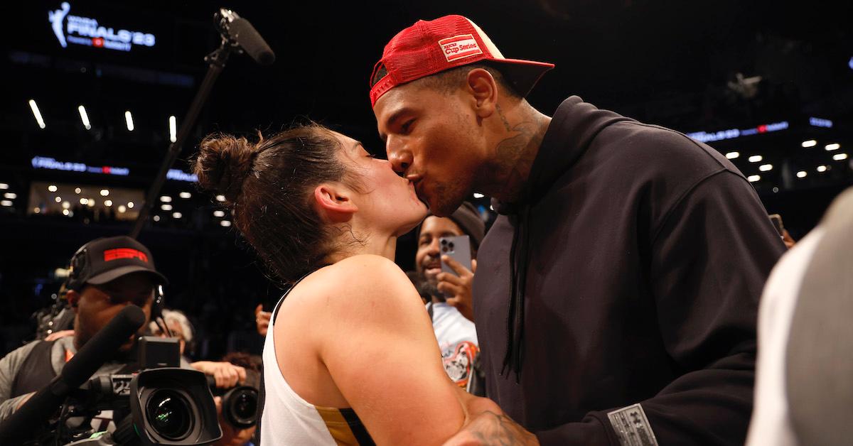 Kelsey Plum kissing Darren Waller after defeating the New York Liberty during Game Four of the 2023 WNBA Finals on Oct. 18, 2023