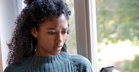 woman looking at phone