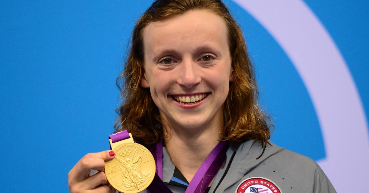 US swimmer Katie Ledecky poses on the podium after winning gold in the women's 800m freestyle final during the swimming event at the London 2012 Olympic Games on August 3, 2012 in London. AFP PHOTO / MARTIN BUREAU (Photo by Martin BUREAU / AFP) (Photo by MARTIN BUREAU/AFP via Getty Images)