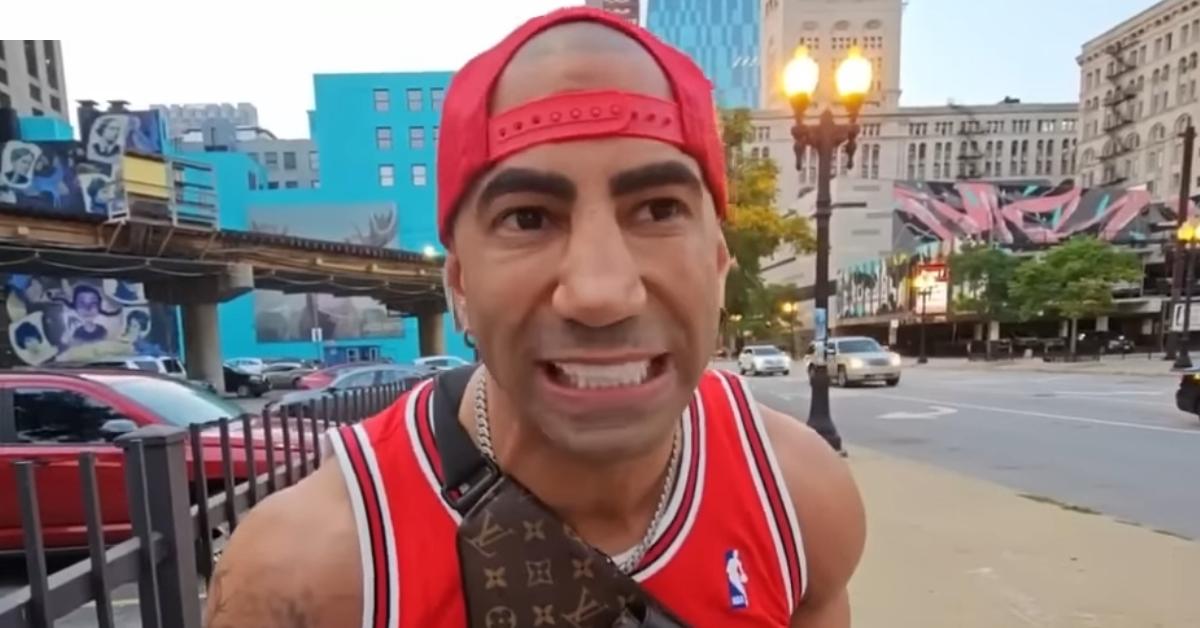 Fousey wears a Chicago Bulls jersey and a red baseball cap.