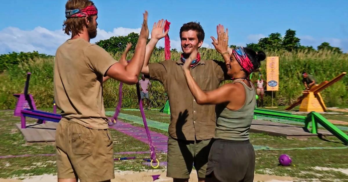 Hunter, Charlie, and Maria high five in 'Survivor 46'