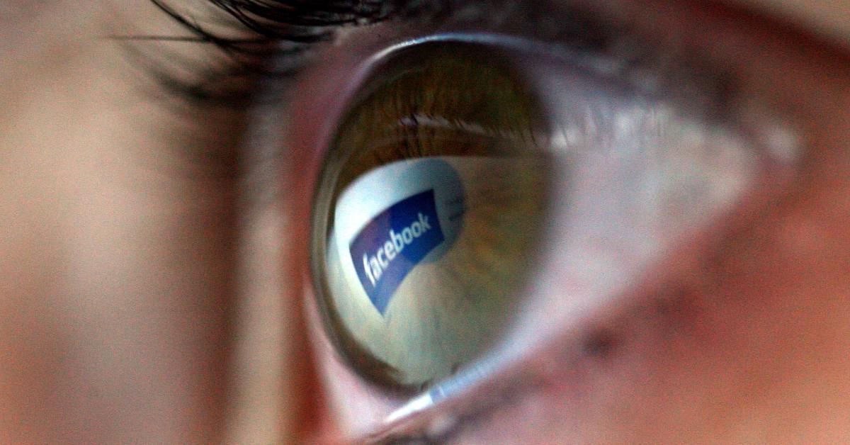 Facebook logo reflected in eye