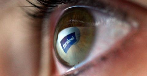 Facebook logo reflected in eye