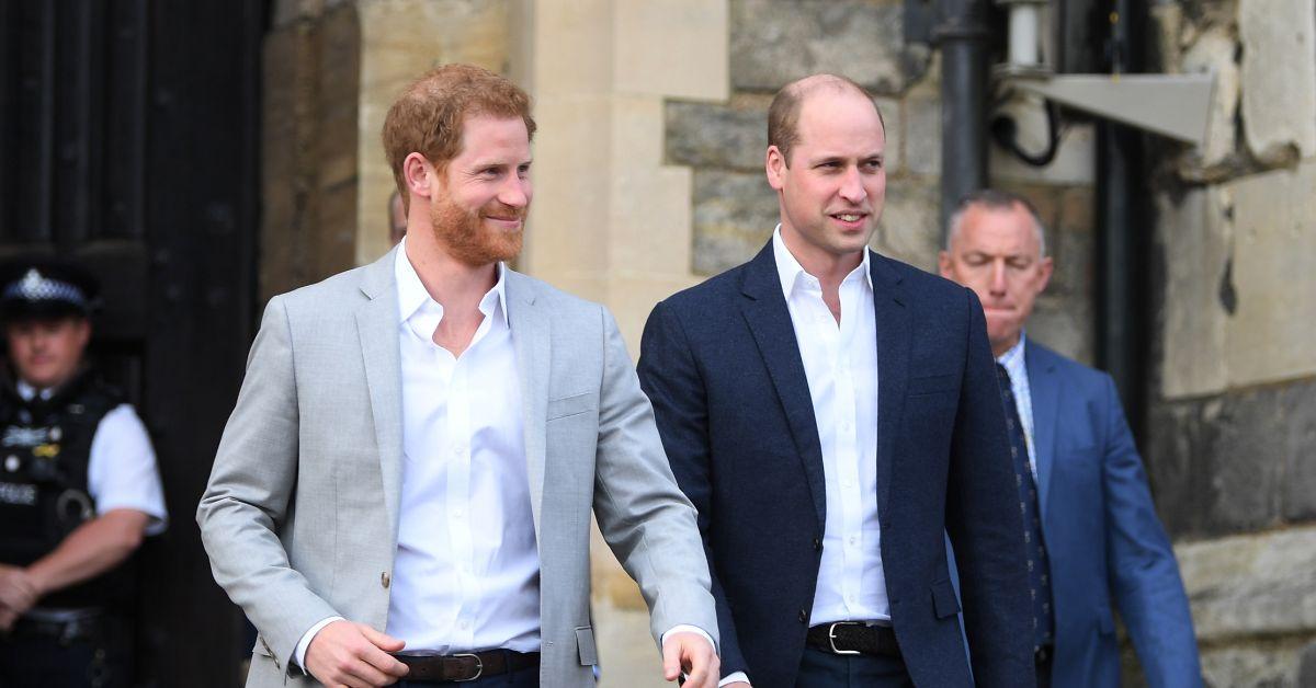 (l-r): Harry and Prince William walking together.