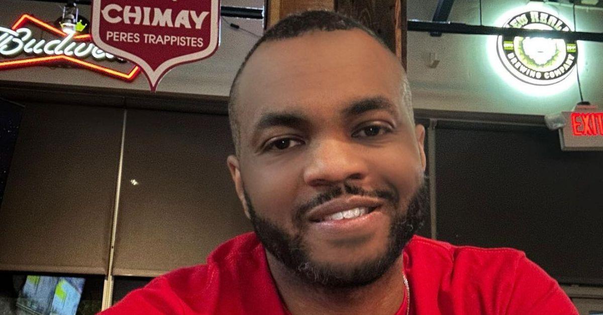 DonJuan Clark wearing a red shirt and smiling. 