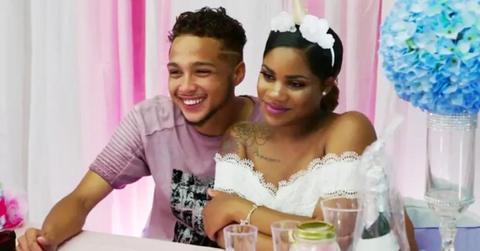 Ashley Jones and Bar Smith sit side-by-side at their wedding shower