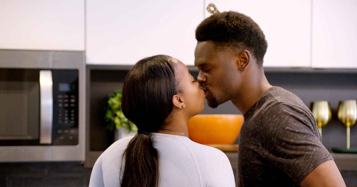 Kalybriah and Edmond kiss in their apartment on Love Is Blind.