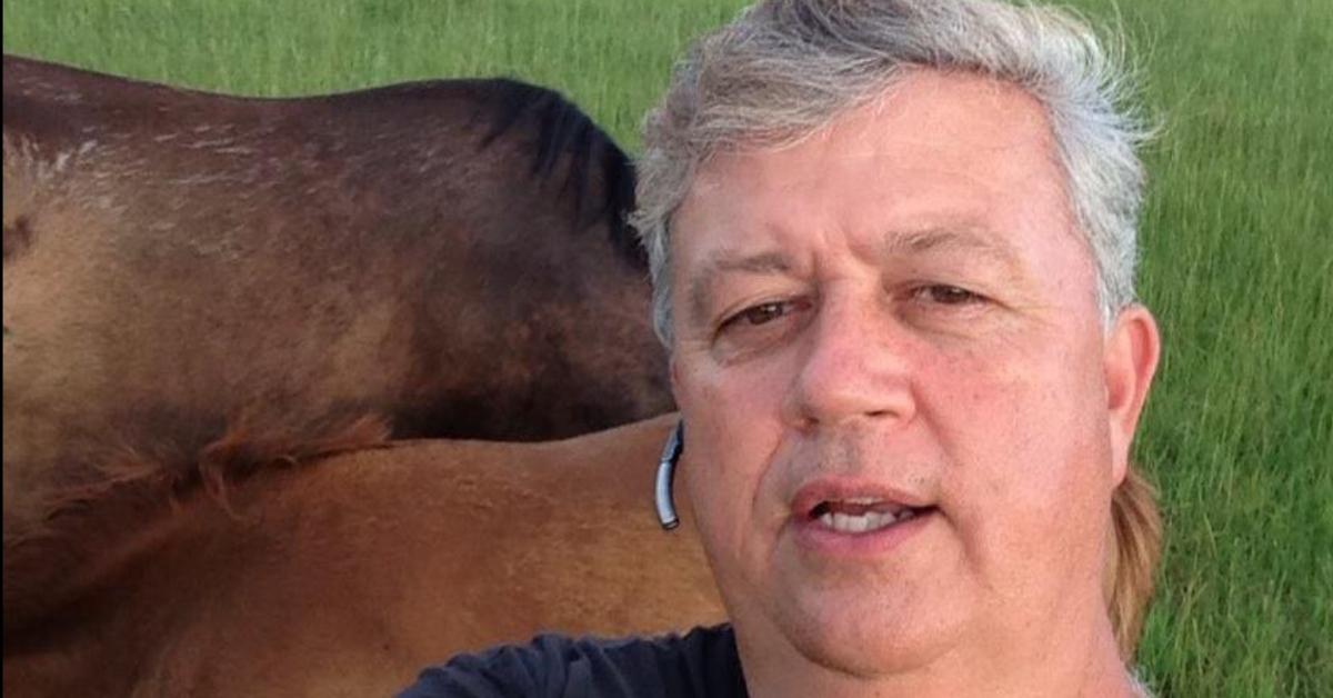 Narvin Lichfield poses with a horse 