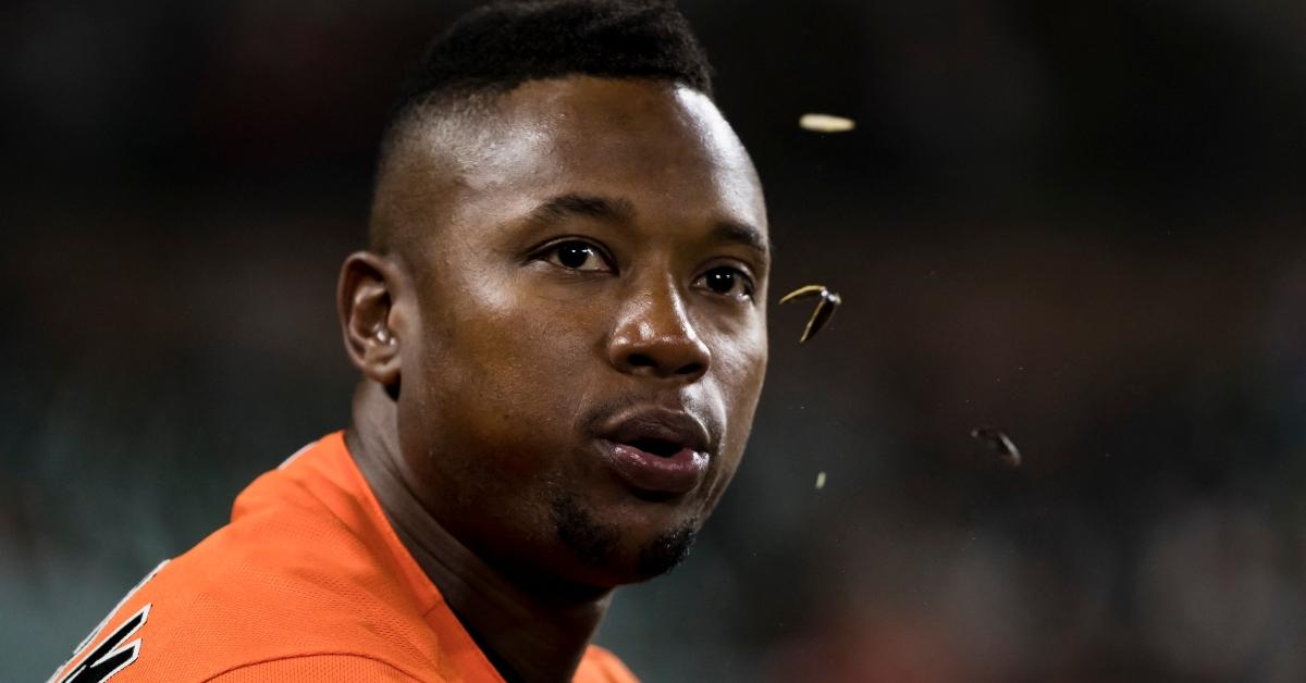 Baltimore Orioles third baseman Tim Beckham spits sunflower seeds from the dugout.