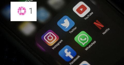 Social media apps on a phone screen with the pink Facebook like button