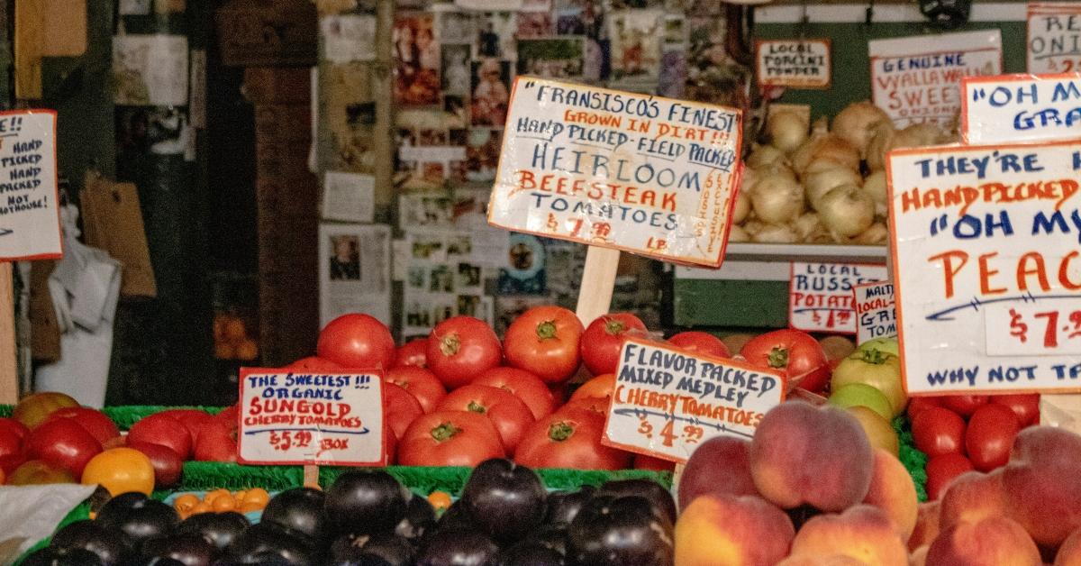 Tomatoes for sale at an outdoor market.